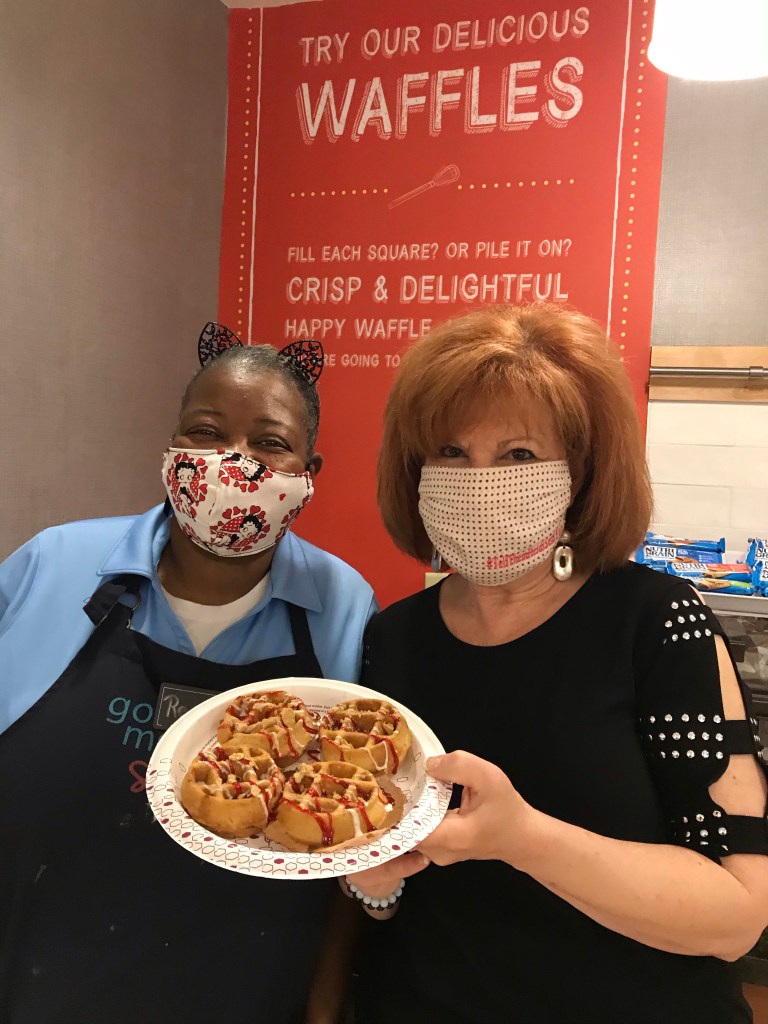 Two women with a plate of waffles